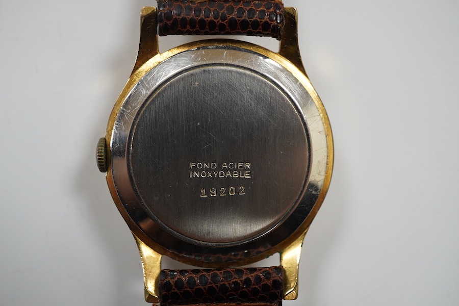 A gentleman's 1950's? steel and gold plated Oska Calendar Moonphase manual wind wrist watch, case diameter 32mm, on a later associated strap. Condition - poor to fair